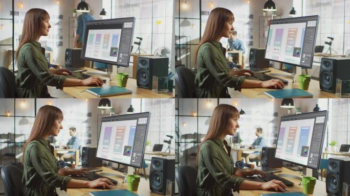 美丽的黑发女设计师在她的个人电脑上大显示屏上使用移动应用界面。她在凉爽的办公室阁楼工作。