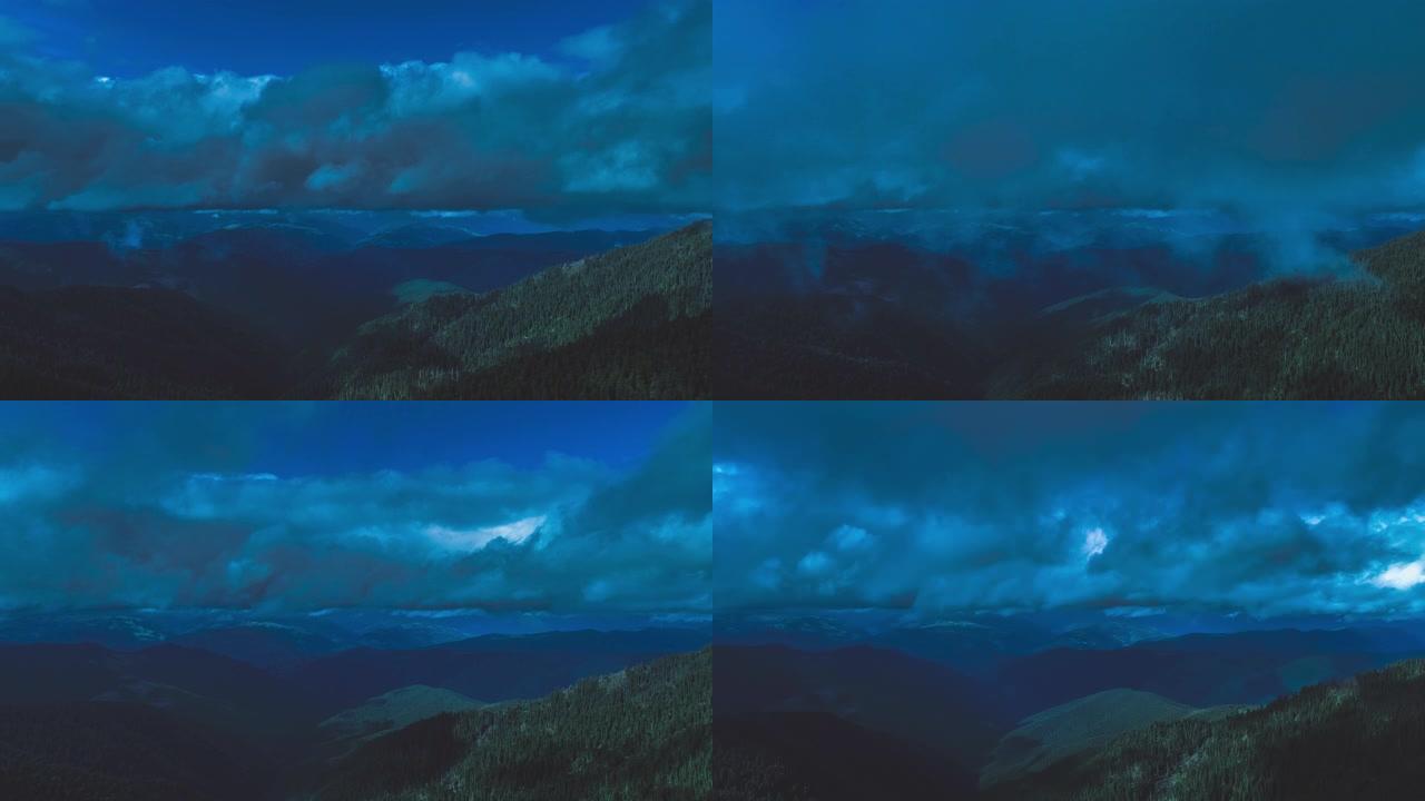 山脉上的飞行对抗着蓝色的云流。过度下垂