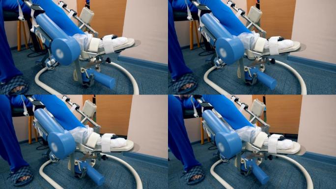 腿部药物治疗。自动机器在医院病房移动病人的腿。