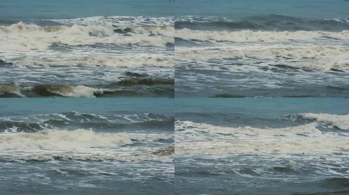 海浪撞击并溅到海滩上