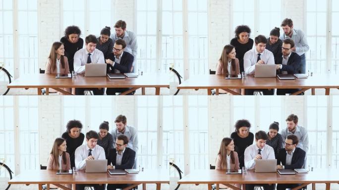 商务团队六人集思广益在办公室用笔记本电脑