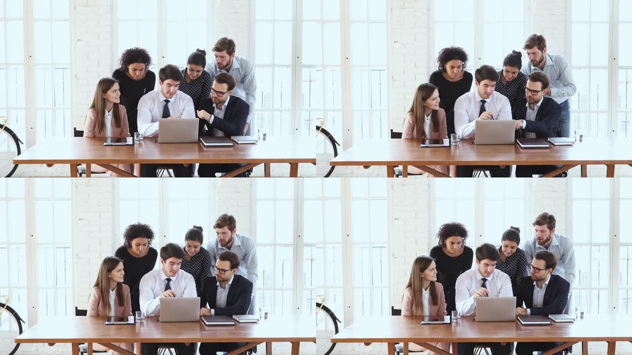 商务团队六人集思广益在办公室用笔记本电脑