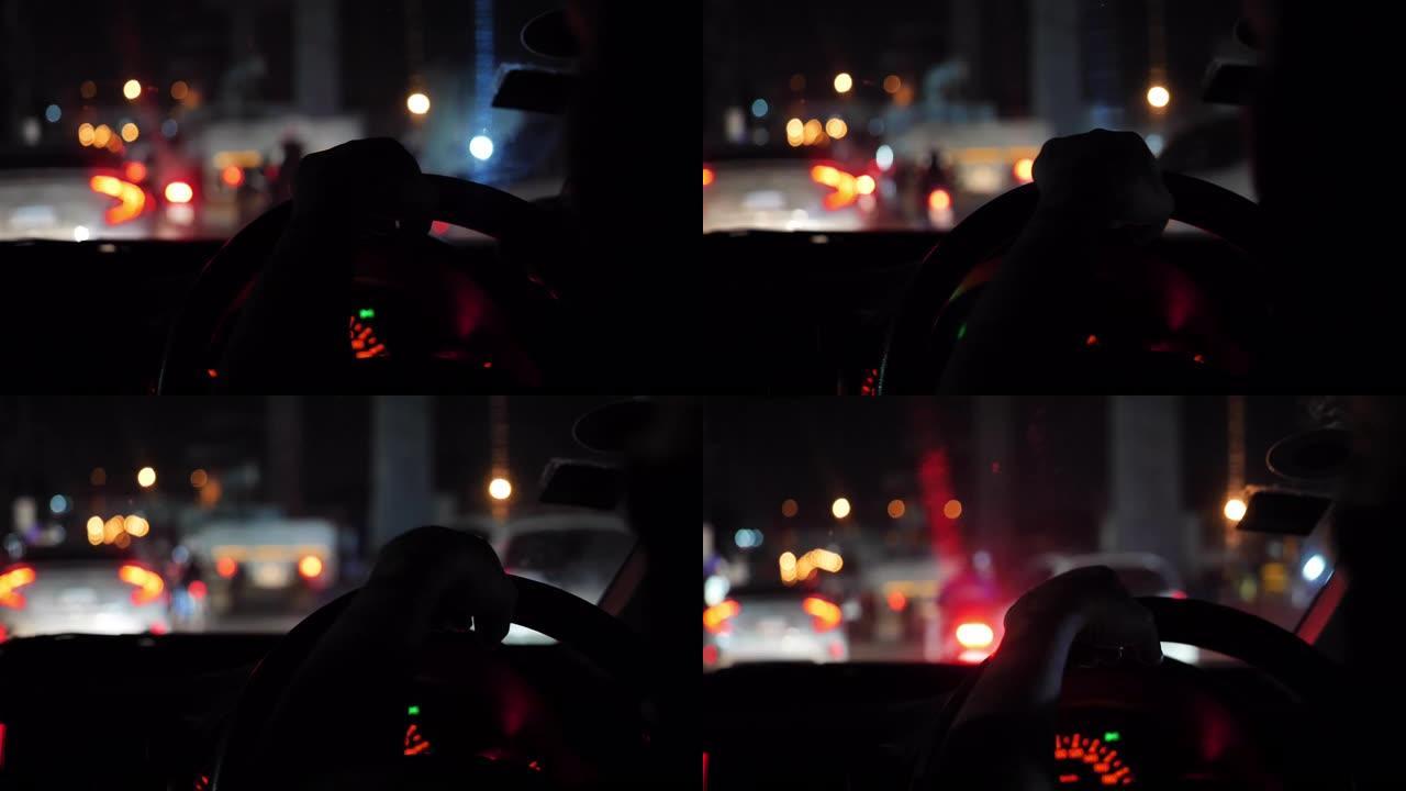 城市的交通堵塞夜间开车驾车实拍