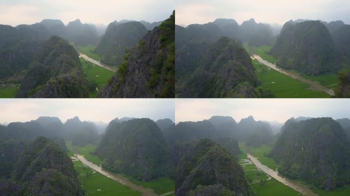 无人机: 飞越大河周围壮观的岩石悬崖。
