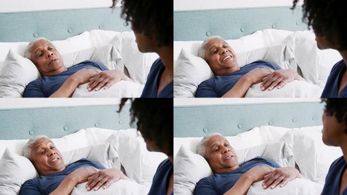 医护人员探视患有疾病的老人躺在床上-慢动作射击