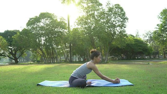 年轻的亚洲女性户外瑜伽在练习瑜伽的同时保持冷静和冥想，探索内心的平静。瑜伽和冥想对健康有很好的好处。