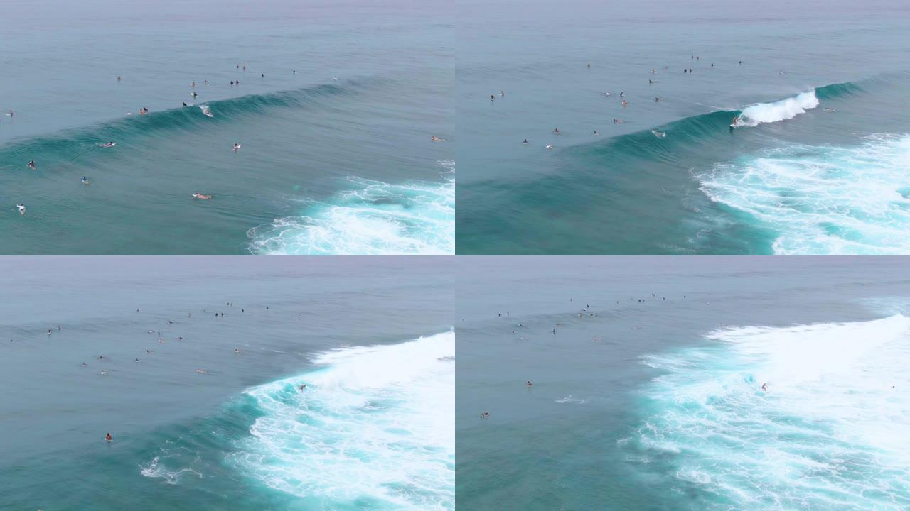 空中: 冲浪者在排队等候的其他冲浪者上架了管波