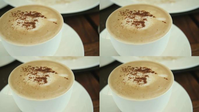 咖啡厅桌上一杯卡布奇诺咖啡的4k镜头