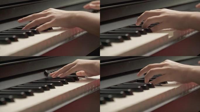特写年轻的亚洲女孩在钢琴课上手工学习