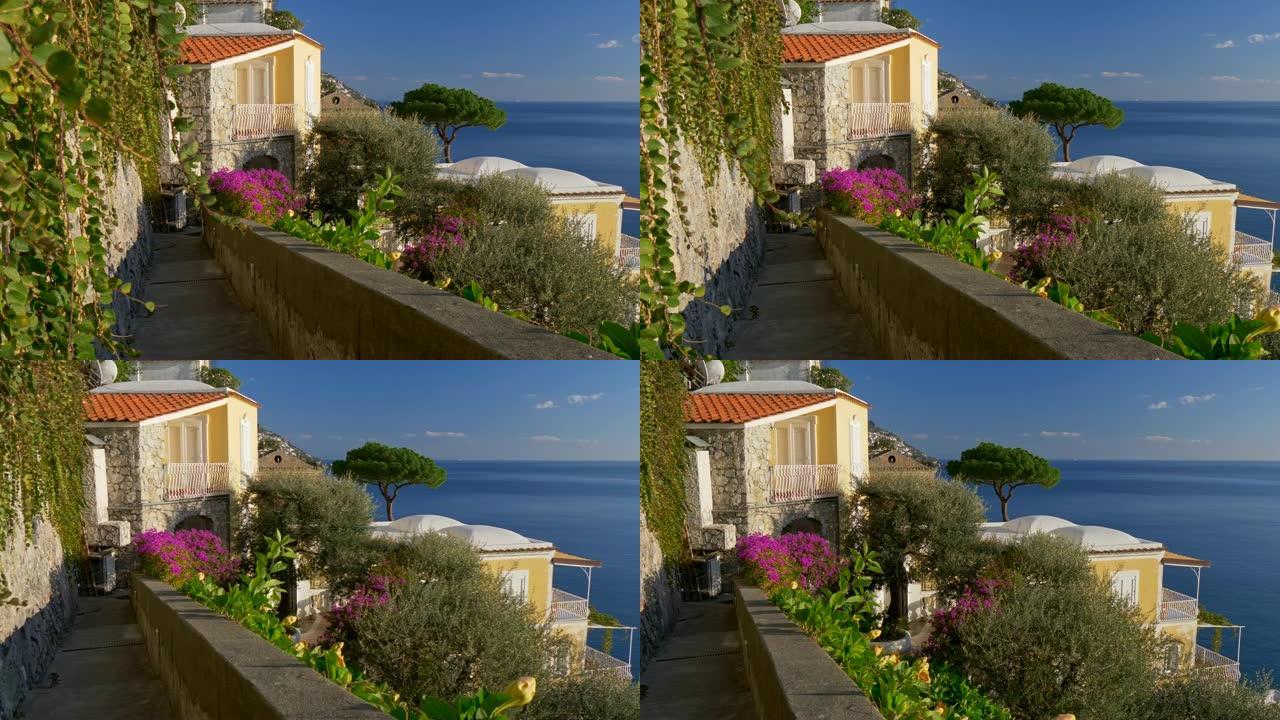 意大利波西塔诺村阿马尔菲海岸被鲜花环绕的优雅别墅。该村庄位于第勒尼安海的海岸。UHD
