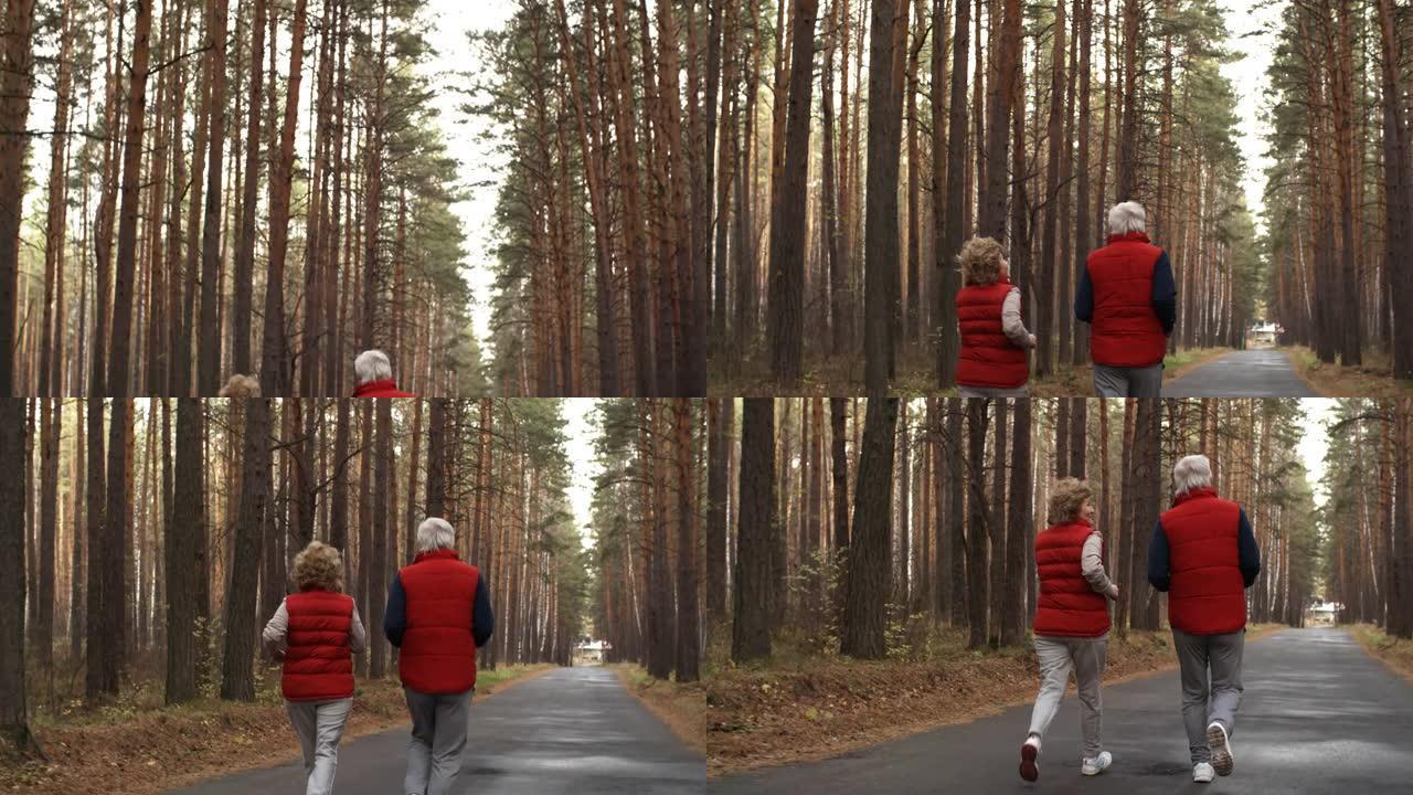 活跃的老年夫妇在树林中奔跑