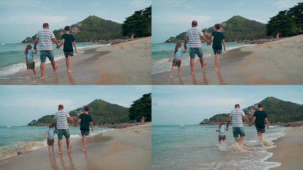 有孩子的父亲喜欢在沙滩上散步