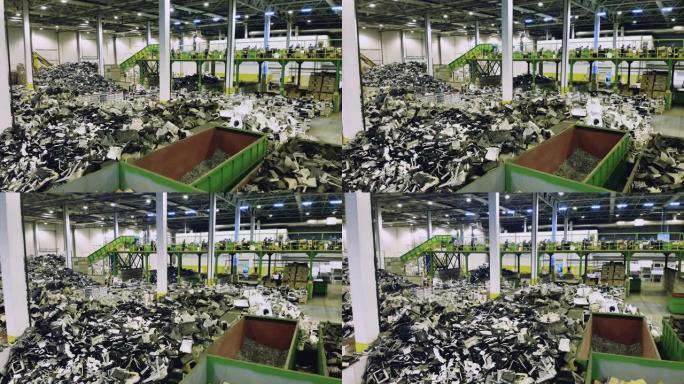 垃圾场堆成一堆的破碎的电子机器碎片。回收工业概念，塑料垃圾回收工厂。