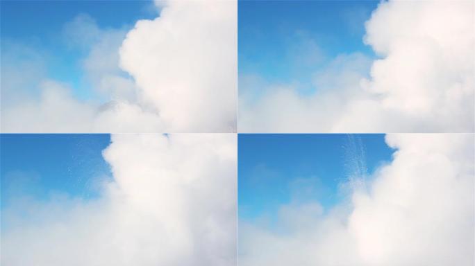 从El Tatio Geyser的间歇泉场上升起的烟雾在蓝天上升起。