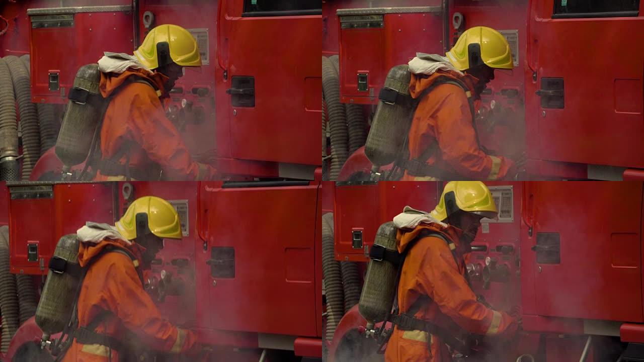 紧急情况: 消防员与卡车一起工作