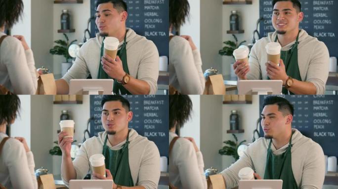 一个年轻的男性咖啡师帮助顾客决定她的饮料大小。