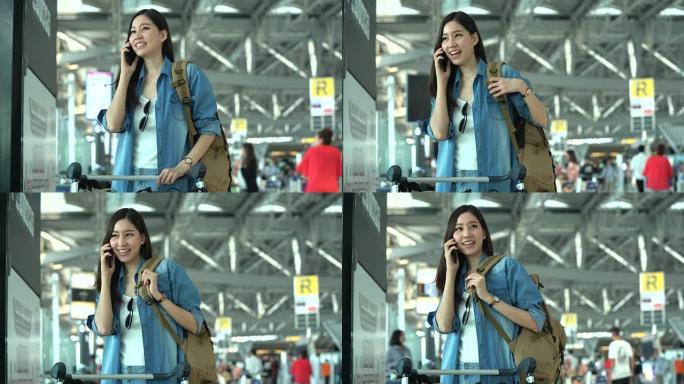 在航站楼机场的登机口，年轻的休闲妇女在智能手机上聊天。年轻妇女独自乘飞机旅行。