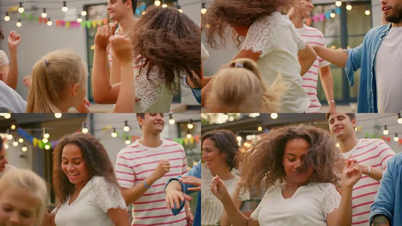 美丽的黑人女孩在花园派对庆典上与家人和朋友一起跳舞。年轻人在阳光明媚的夏日迪斯科舞厅玩得开心。