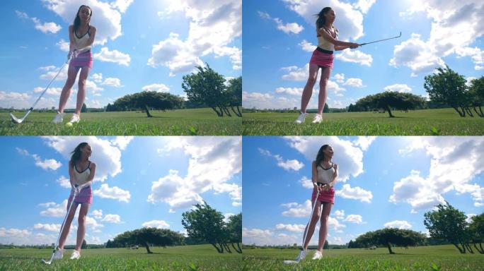 一个女孩在草地上打高尔夫球。
