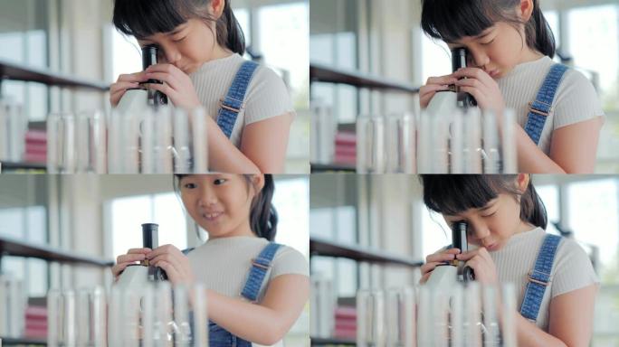 有趣的小女孩在实验室做实验。科学与教育。教育主题