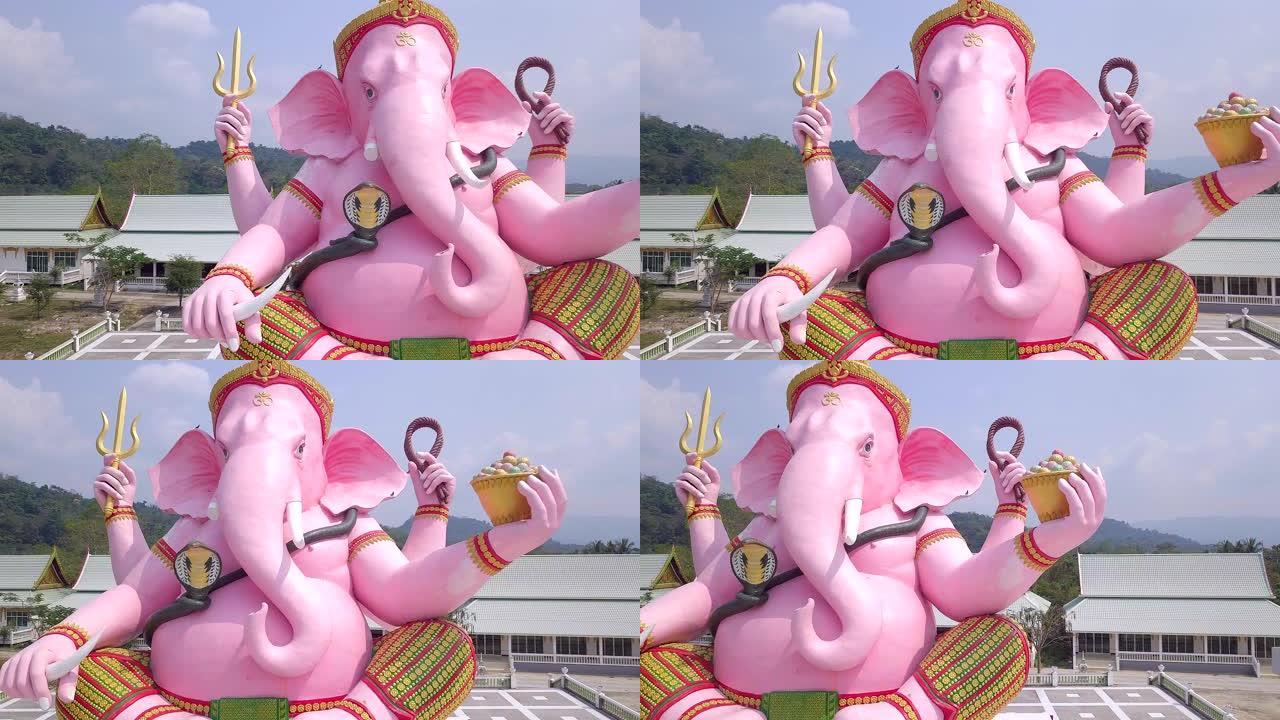 粉色甘尼萨雕像东南亚风光建筑