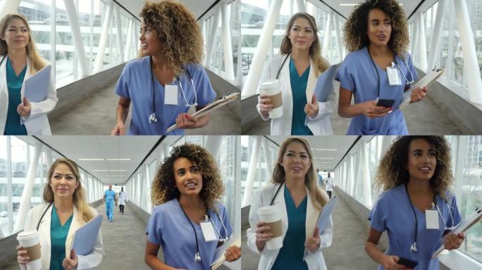 忙碌的女性医疗保健专业人员走在医院的天桥上