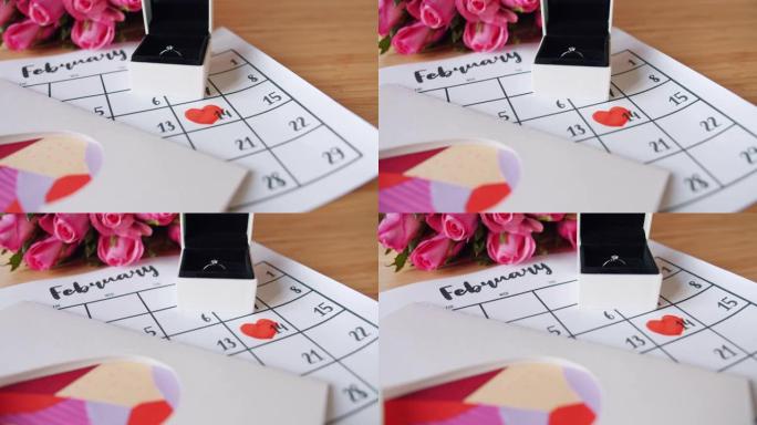 情人节装饰品玫瑰、礼品盒戒指、创意卡片和日历