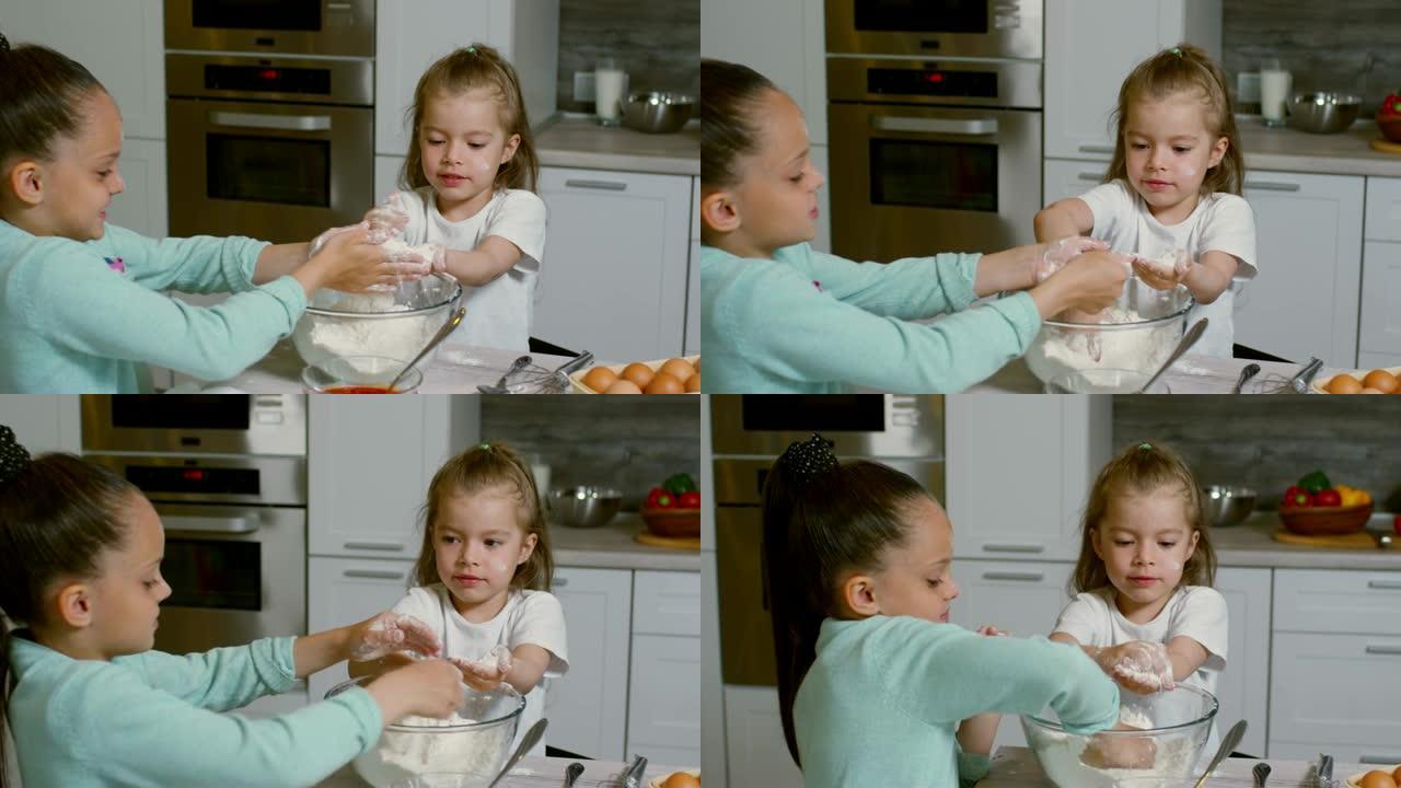 两个小女孩学做饭