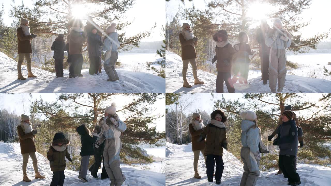 五个兴奋的孩子在雪地里跳跃