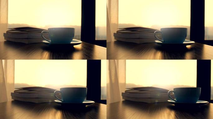 桌上有书的咖啡杯
