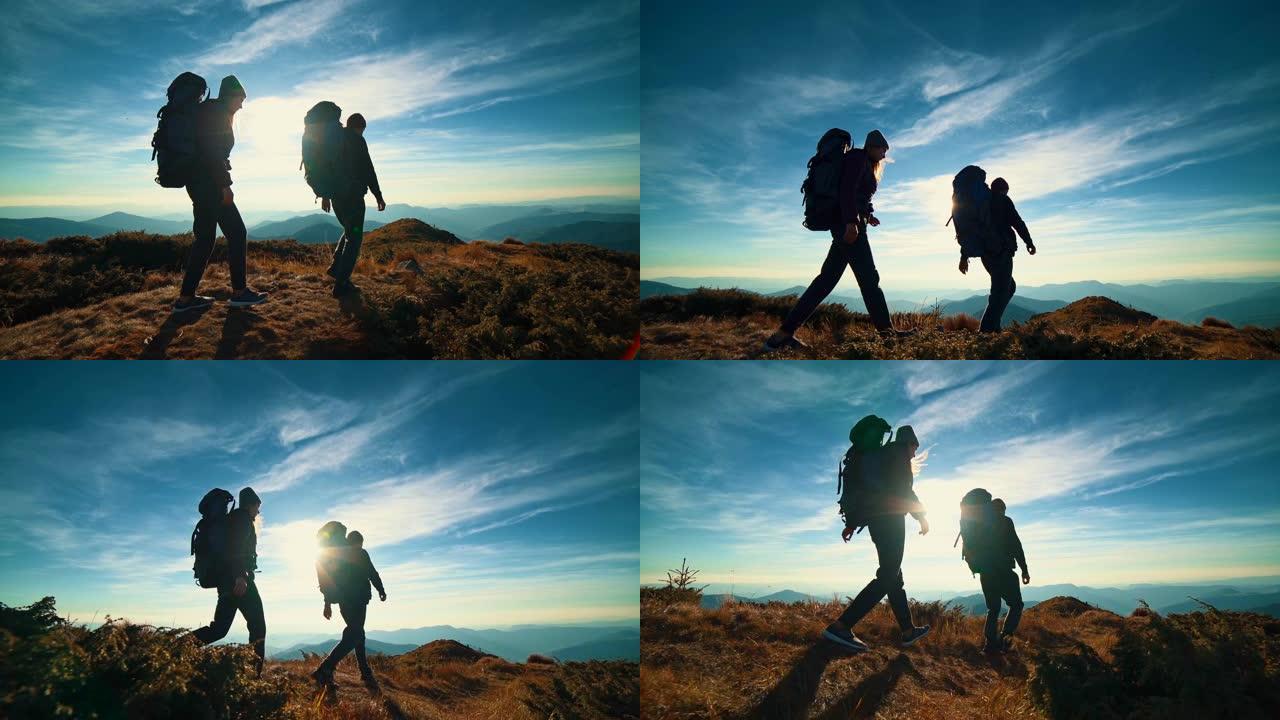 这对夫妇在明亮的阳光下走在山上。慢动作