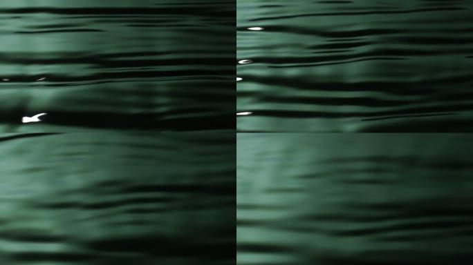 慢动作: 水波图案的绿色背景。