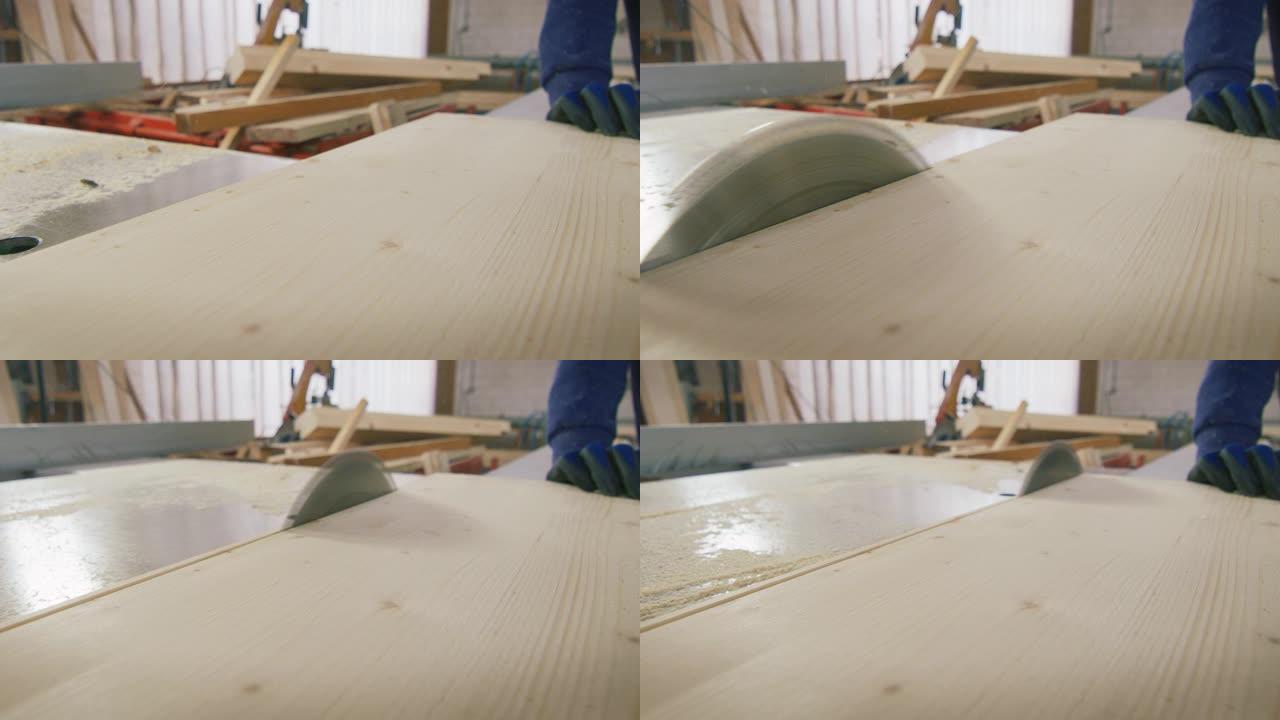 用工业锯木厂从原木上锯切木板的宏观特写。
