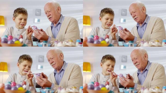 祖父和孙子一起画鸡蛋