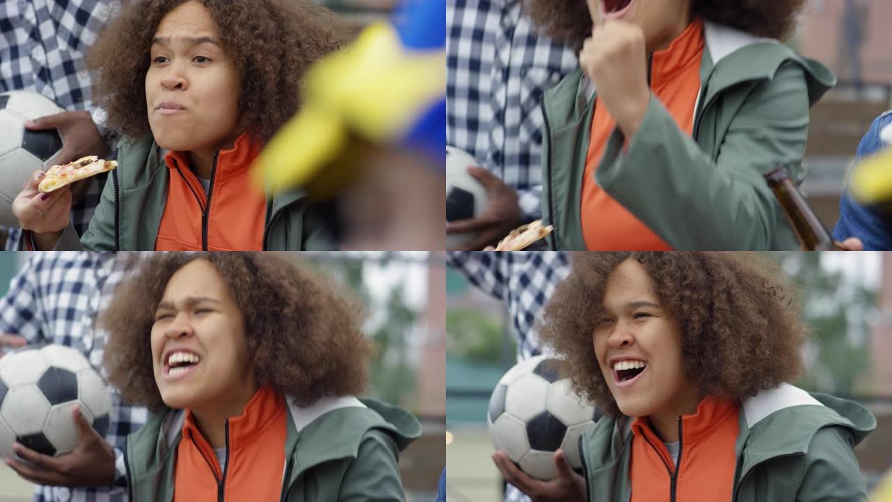 非裔美国女孩观看足球并兴奋地大喊大叫