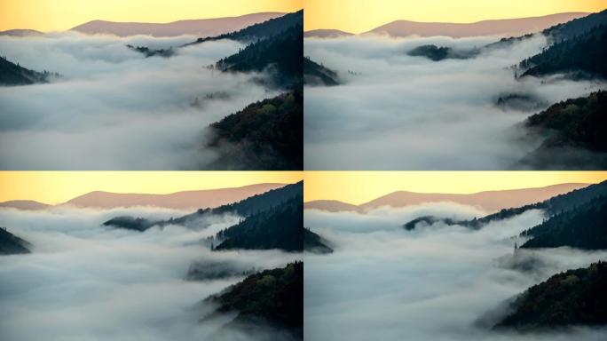 雾山中的美丽日出。在清晨的绿山上有一段时间的跑雾。4 k, UHD