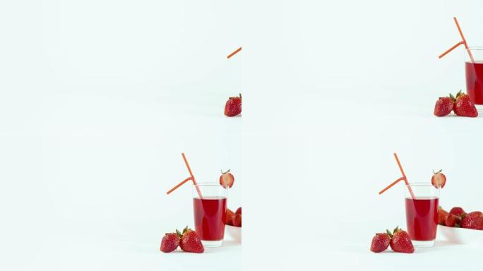 白色桌子上摆满一杯草莓汁