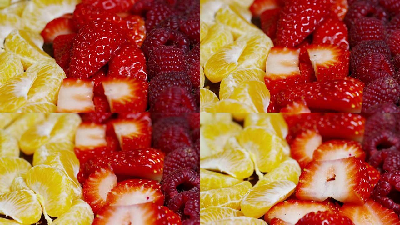 新鲜水果混合成分，包括草莓，苹果，蓝莓，覆盆子，猕猴桃，橙子。夏季吃新鲜和异国情调的热带水果沙拉。颜