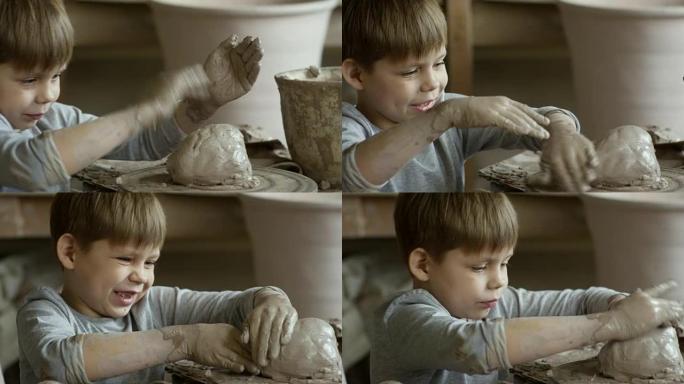 玩湿陶土的可爱男孩