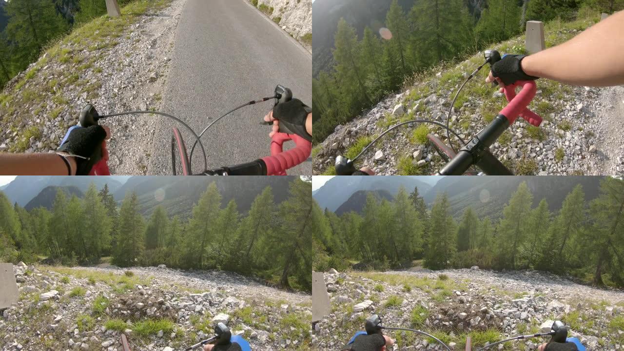 镜头耀斑: 男性公路骑自行车的人在攀登过程中停下来观察山脉。