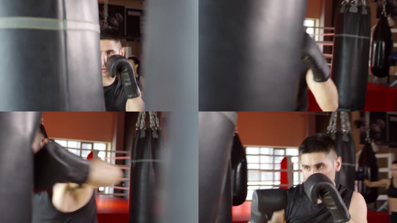 男女拳击手在健身房练习拳打