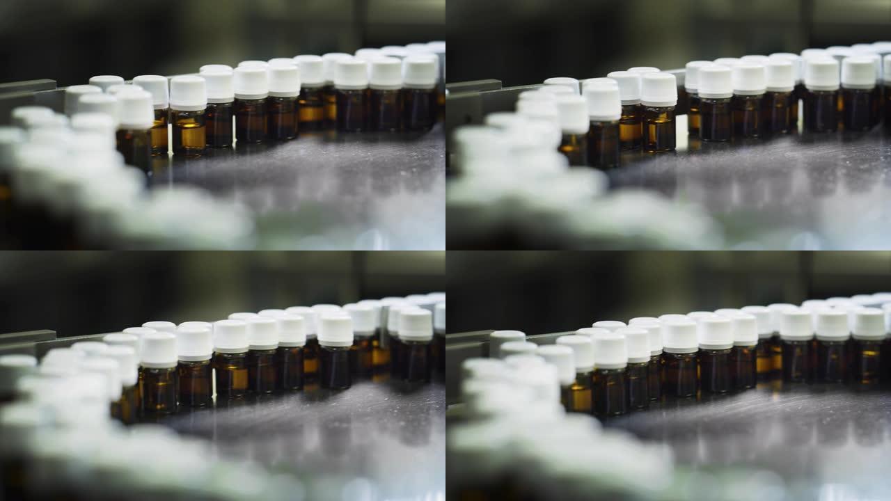在制药厂的自动线上关闭玻璃器皿瓶中的药品生产。