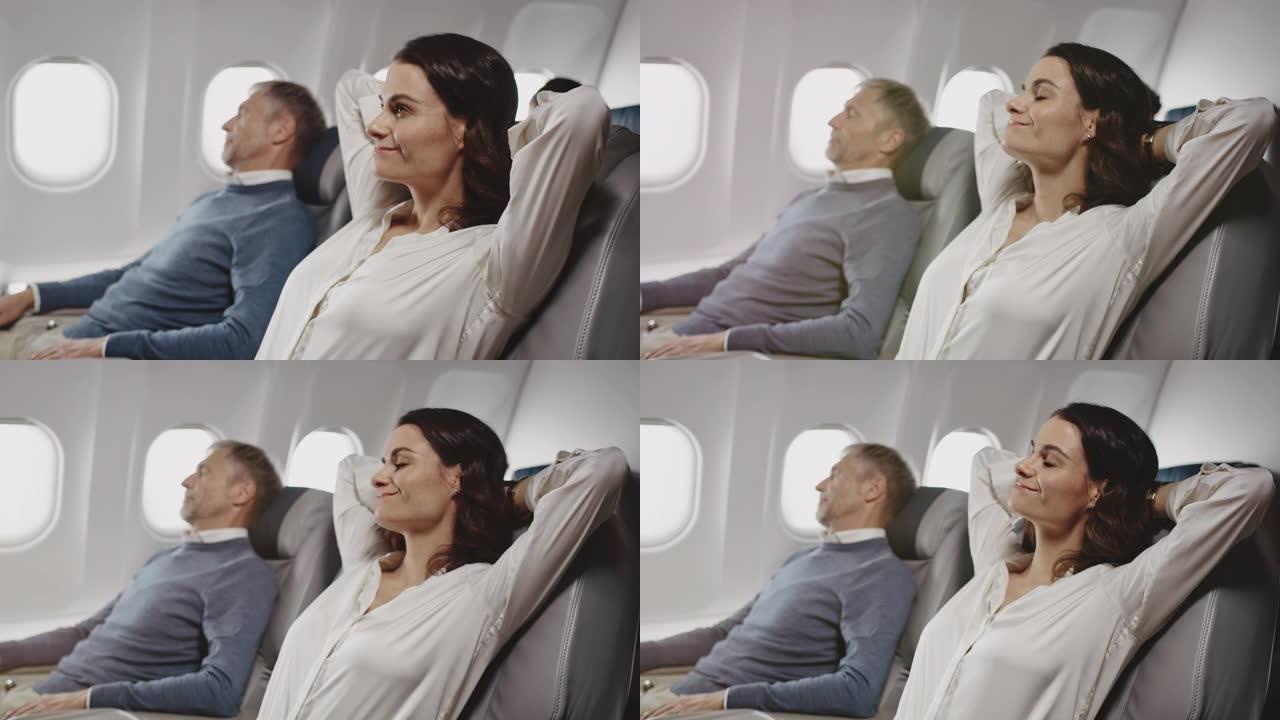 同事在飞机上放松的女商人