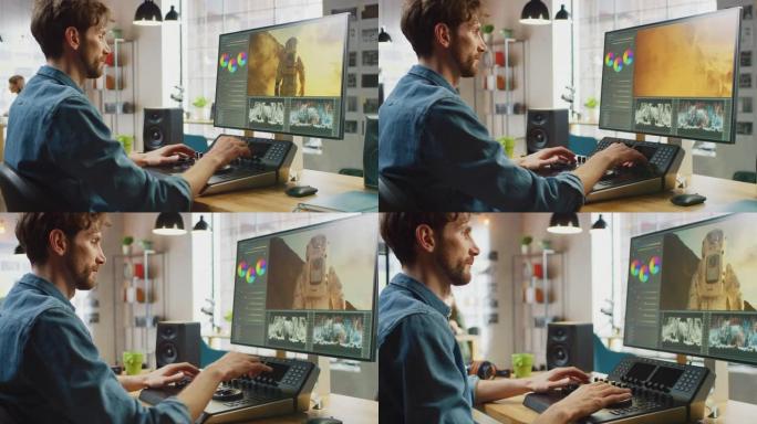 带有胡须和牛仔裤衬衫的男性视频编辑器使用编辑控制台甲板在他的个人计算机上处理镜头。他在一个很酷的办公