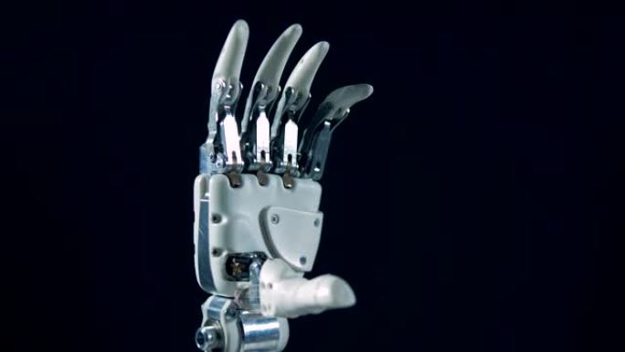 白色机器人手弯曲手指，特写。