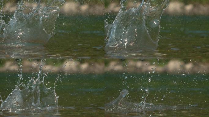 宏观: 光滑的卵石从河面反弹后，玻璃状的水飞溅。