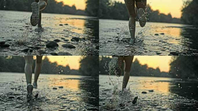 在河边奔跑的女跑步者的SLO MO腿