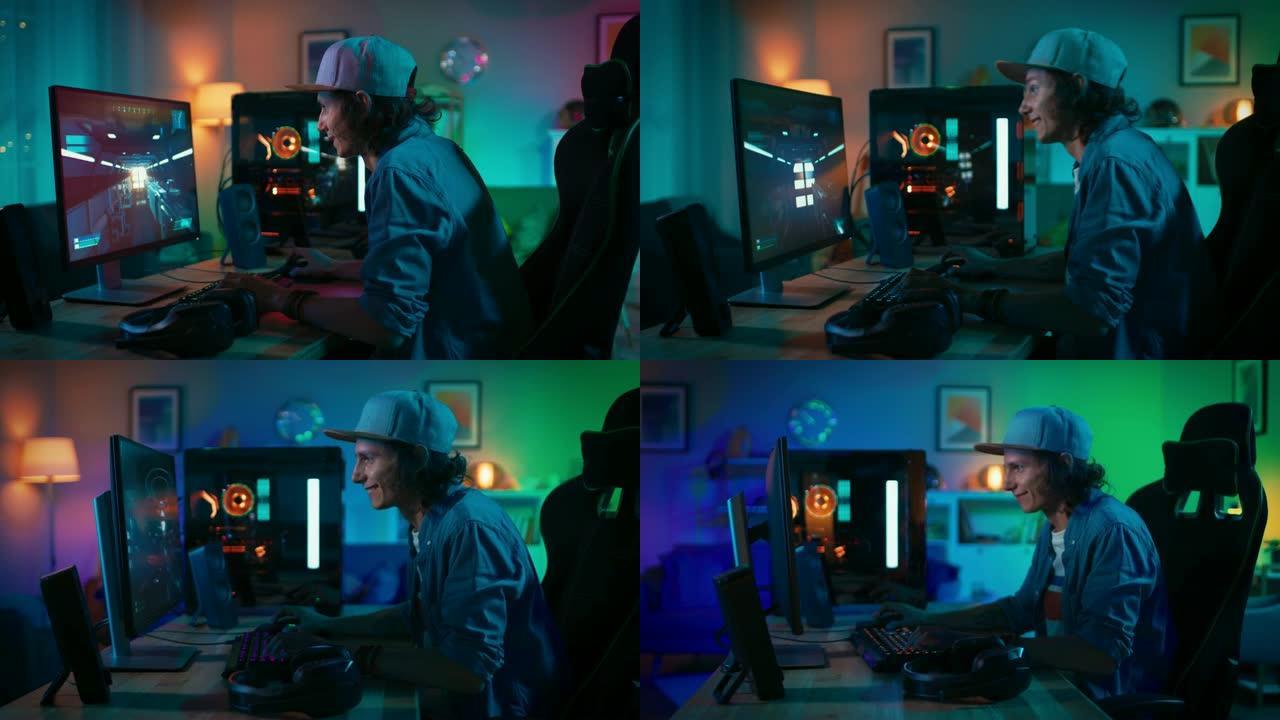 快乐的玩家在他的个人电脑上玩第一人称射击游戏在线视频游戏。房间和电脑有彩色霓虹灯。年轻人戴着帽子。在
