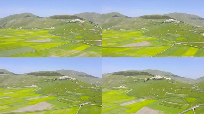 WS Sunny风景鸟瞰图绿色农田和山地景观，Castelluccio，翁布里亚，意大利