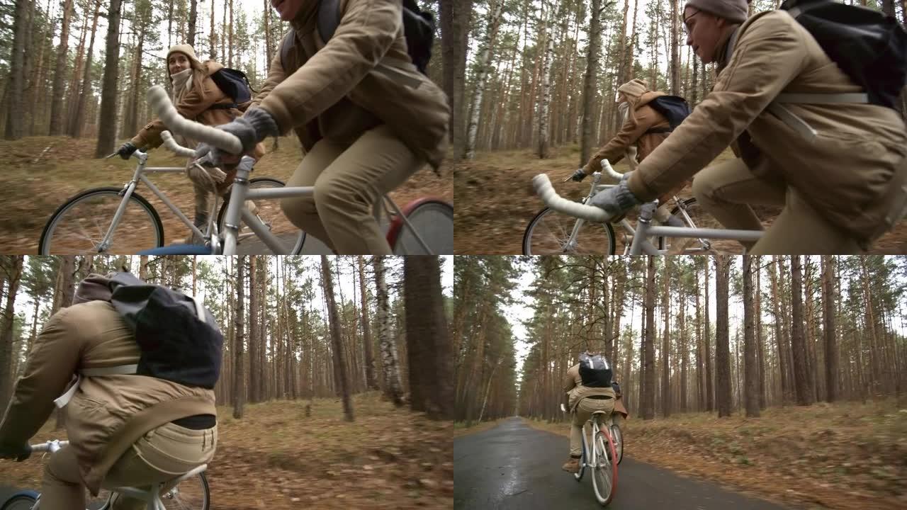 夫妇骑自行车穿越秋天的森林